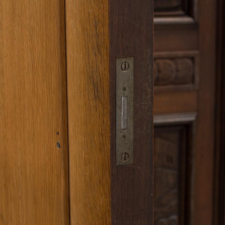 A circa 1900 oak cabinet.