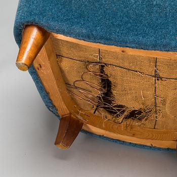A pair of mid-20th-century armchairs.