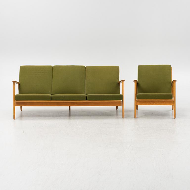 A mid 20th century sofa and armchair.