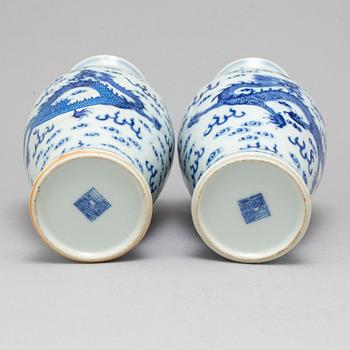 A pair of Chinese blue and white dragon vases, early 20th century, with a Qianlong mark.