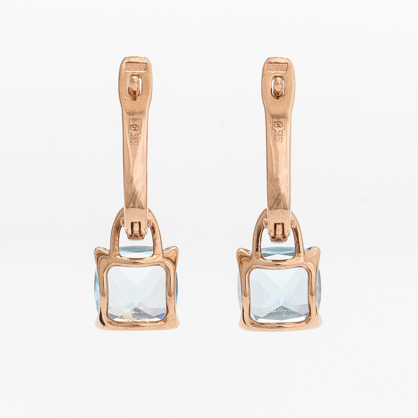 A pair of 14K rosegold earrings, with diamonds and topazes. Soviet Union.