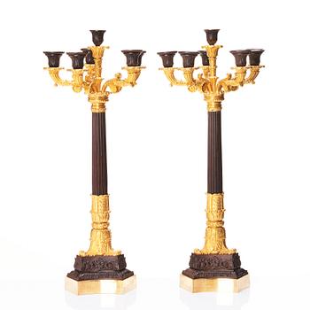 A pair of French Louis Philippe six light candelabra, around 1830.