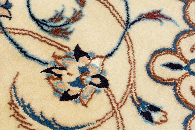 A carpet, Nain, part silk, fine 9 laa, signed, ca 327 x 210 cm.