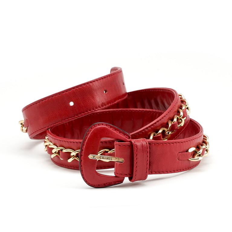 CHANEL, a red leather and gold chain belt.