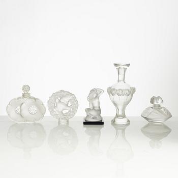 Lalique, four perfume bottles and five figurines, France, after 1945.