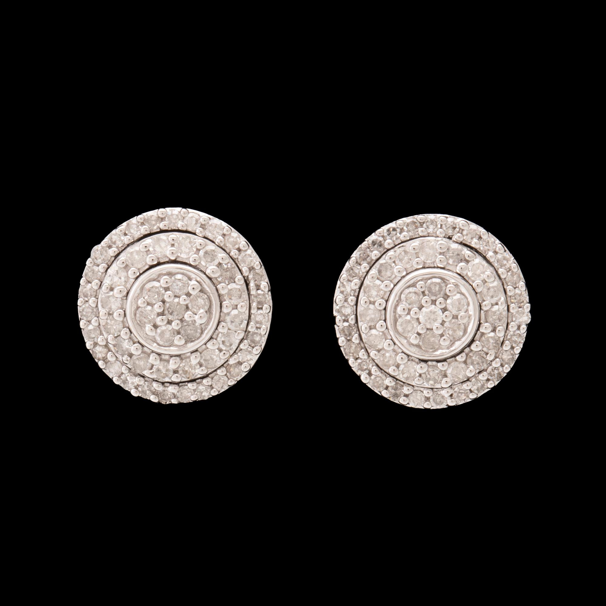 A pair of 14K white gold earrings set with round single-cut diamonds.
