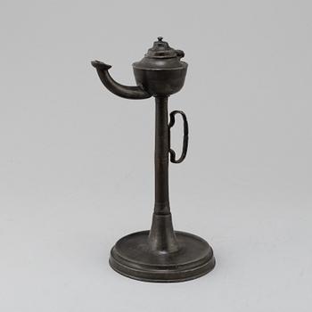 An 18th century pewter oil lamp.