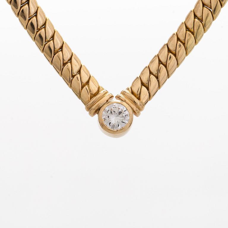 Collier, 18K guld och en briljantslipad diamant.
