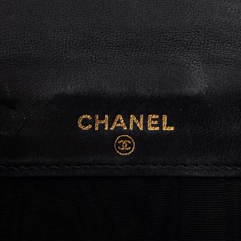 Chanel, a black caviar leather wallet.