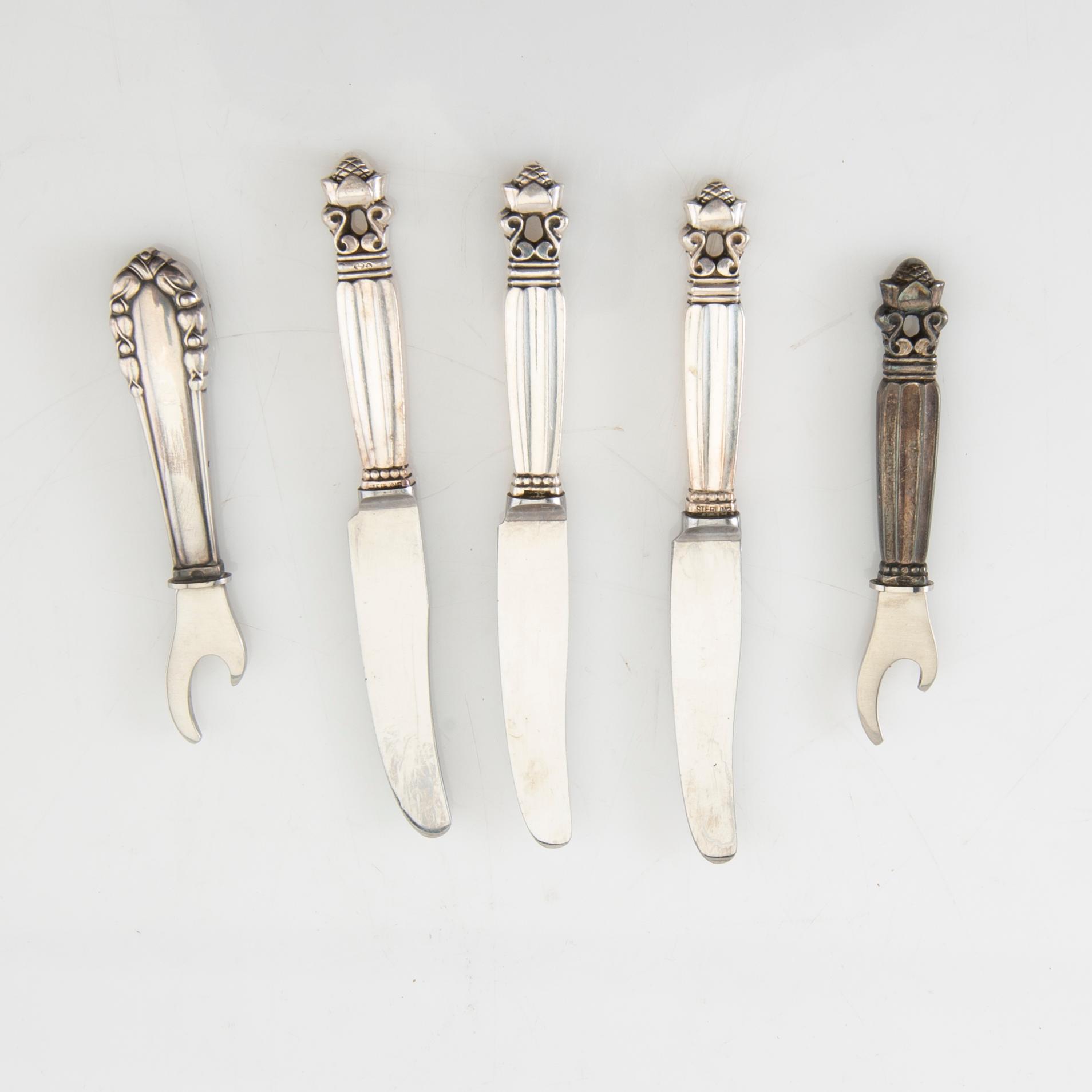Johan Rohde, knivar 23 st + kapsylöppnare sterlingsilver  "Konge/Acorn" för Georg Jensen Danmark 1900-talets första hälft.