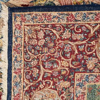 A CARPET, a semi-antique Kerman figural, ca 248,5-250 x 155 cm.