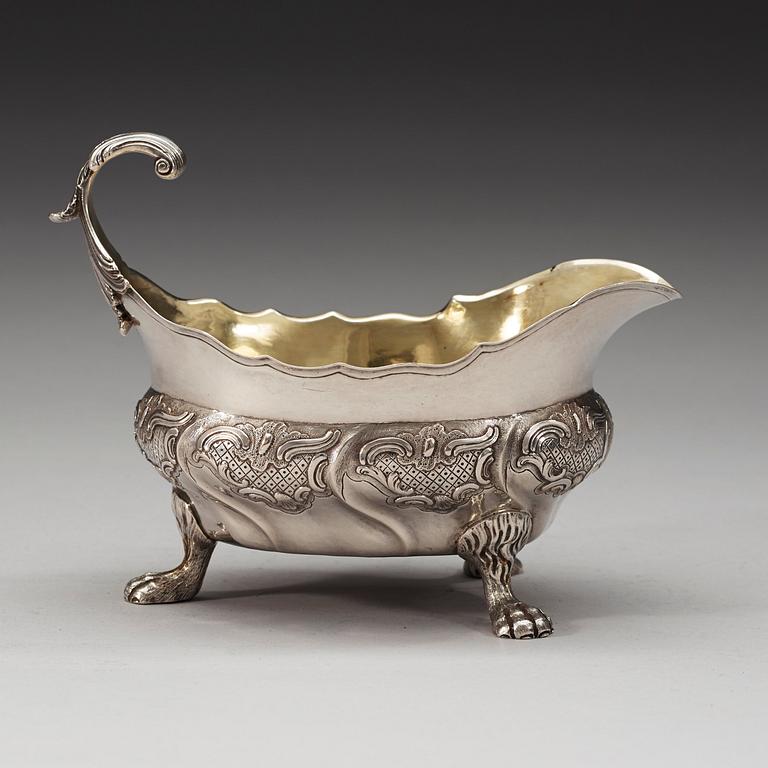 A Swedish mid 18th century parcel-gilt sauce-boat, marks of Kilian Kelson, Stockholm 1755.