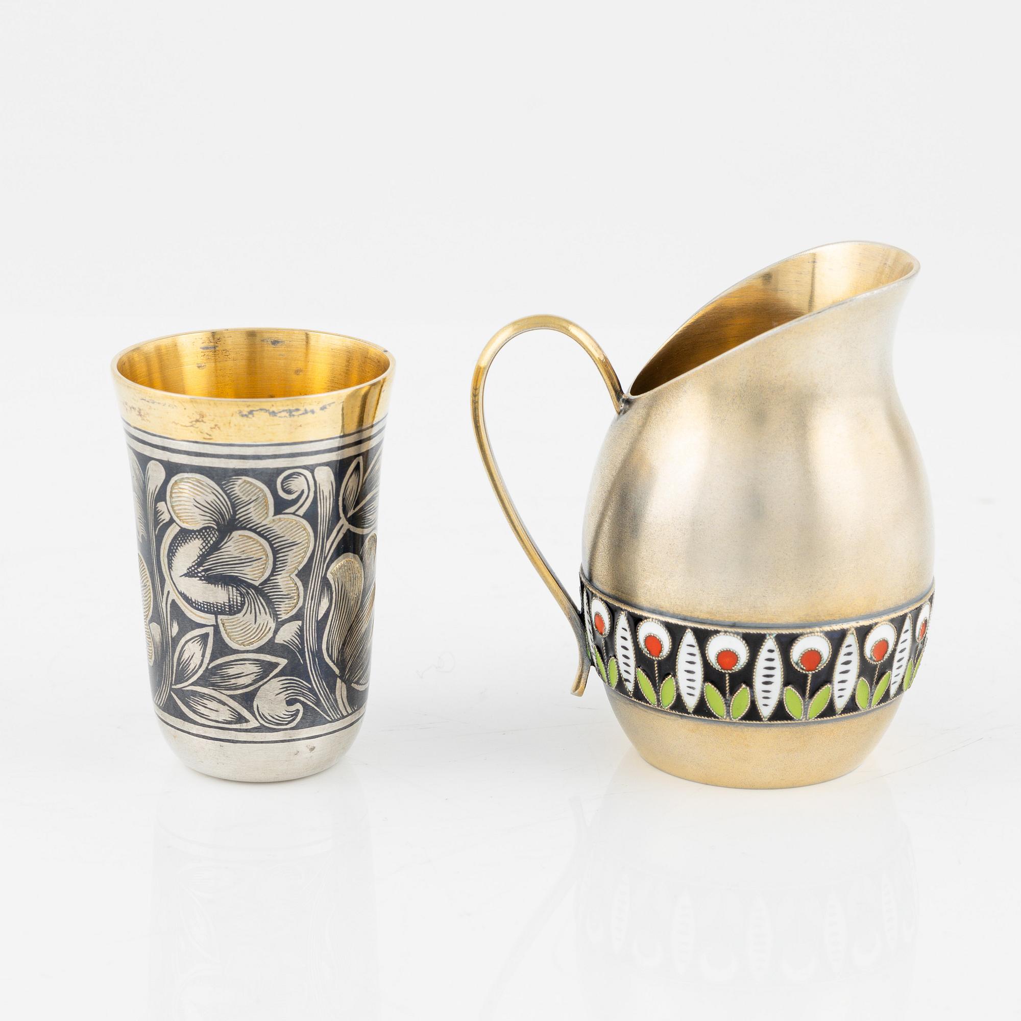 A Russian Silver-Gilt and Enamel Creamer and a Parcel-Gilt Silver Niello Beaker, Leningrad 1960s.