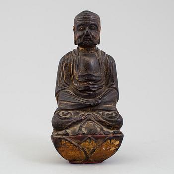 A wooden Japanese sculpture of a deity, 19th Century.