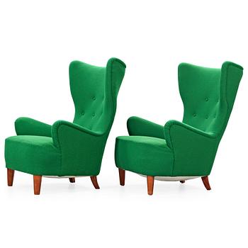 526. A pair of Arne Färnrot upholstered armchairs, Sweden 1940's-50's.