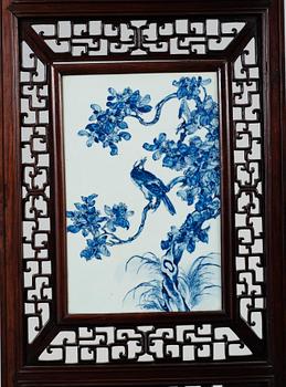 A four panel screen with porcelain placques, Qing dynasty, 19th Century.