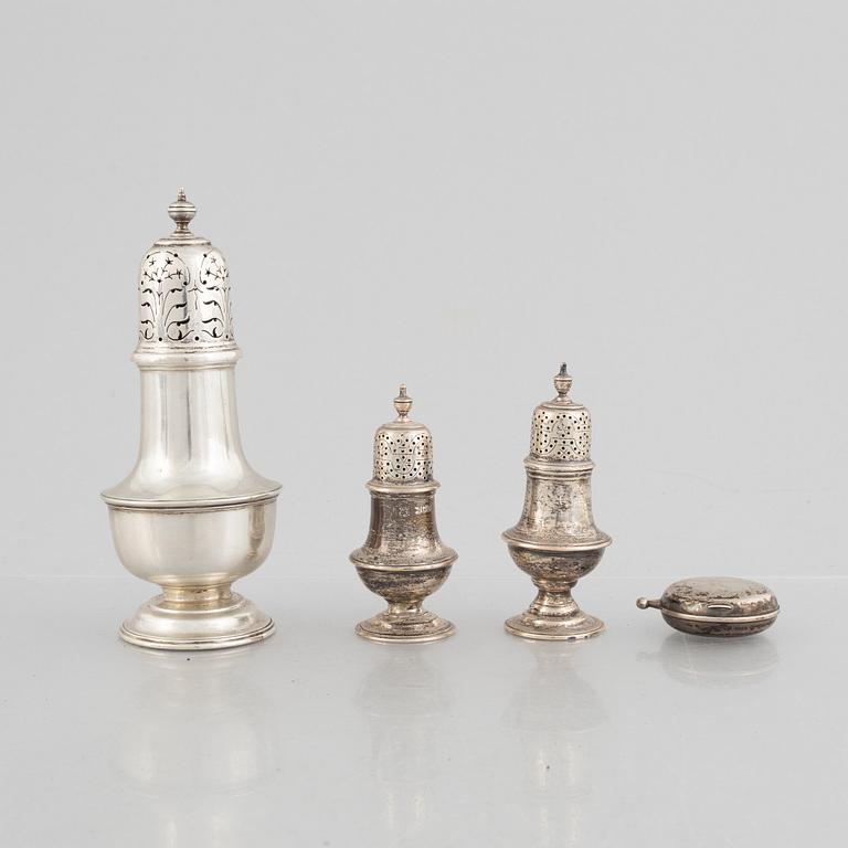 A sugar caster, a salt and pepper shaker, and a snuff-box, silver, including Daniel & John Wellby, London, England 1905.