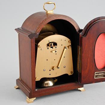 A table ckock by Elliot from London in the 20th century.