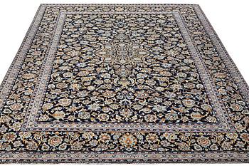 A Kashan carpet, signed, c. 381 x 285 cm.