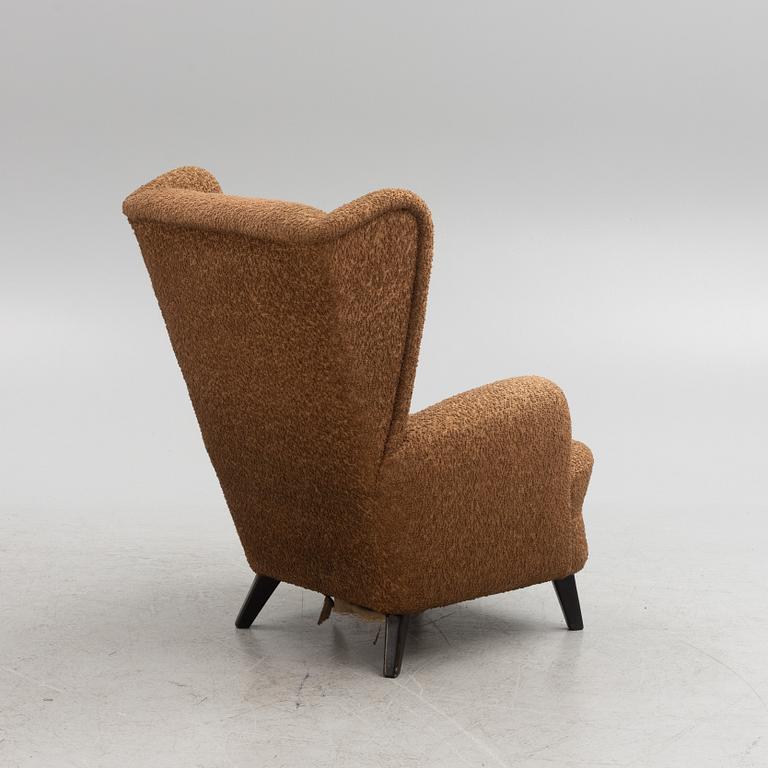 A wingback armchair, mid-20th Century.