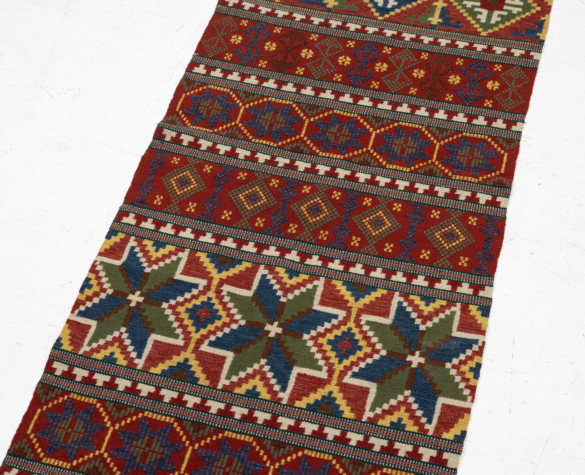 A bench cushion, flat weave, c. 262 x 64 cm, Scania, around the year 1900.