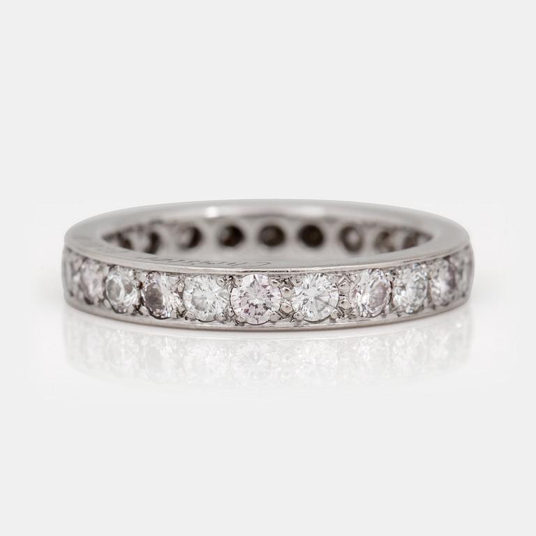 A fancy pink and colourless diamond eternity ring.