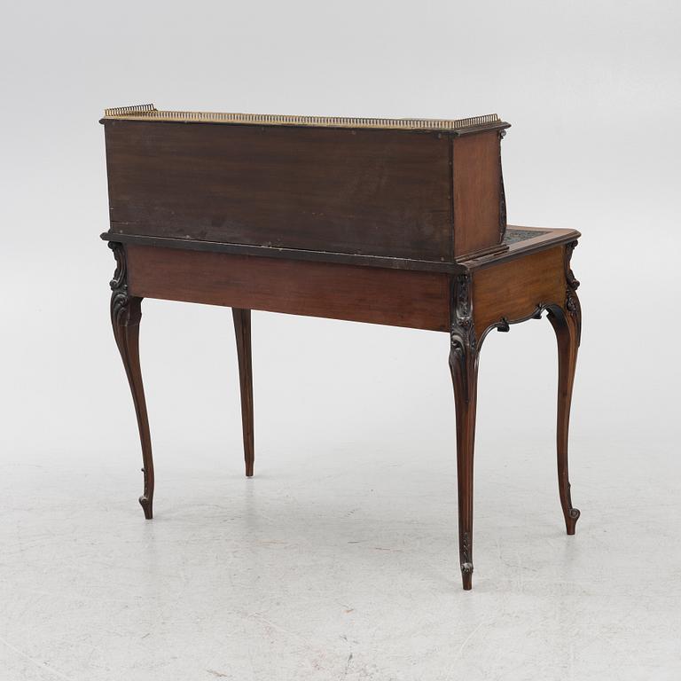 A mahogany veneered desk, mid 20th Century.