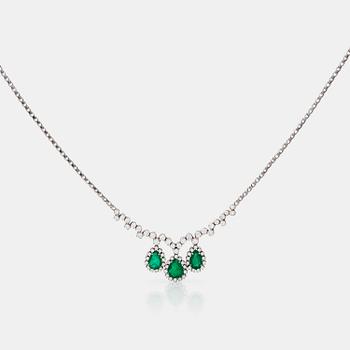 1196. A 4.68ct pear shaped emerald and 3.49ct brilliant-cut diamond necklace.