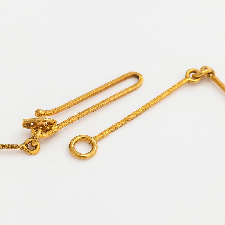 Björn Weckström, an 18K gold 'Nymph's Eye' necklace with a tourmaline. Lapponia.