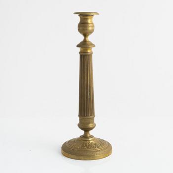A brass Empire candlestick, first half of the 19th century,