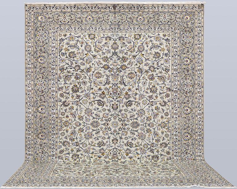 A Keshan carpet, signed, 397 x 302 cm.