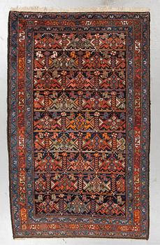 A rug, a semi-antique/an old Garaghan, ca 223 x 135-141 cm.