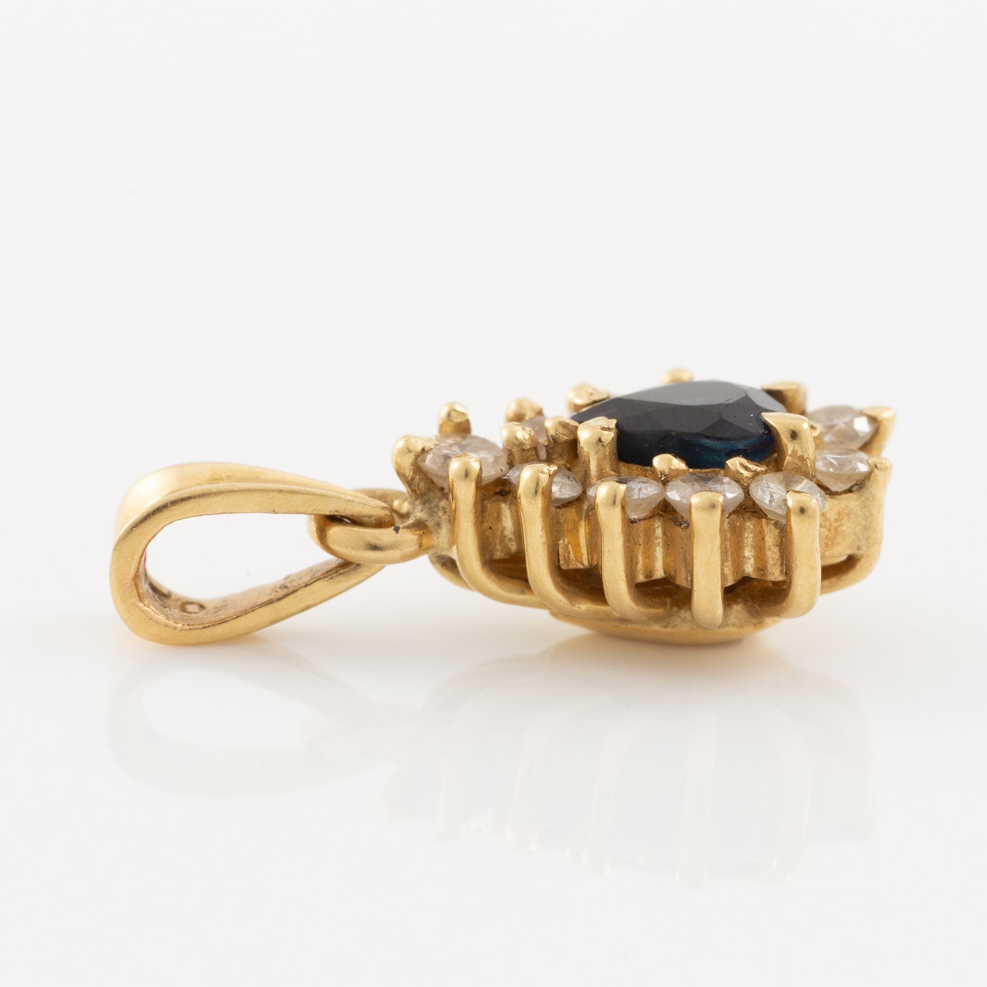 Pendant, 18K gold, set with a sapphire and brilliant-cut diamonds.