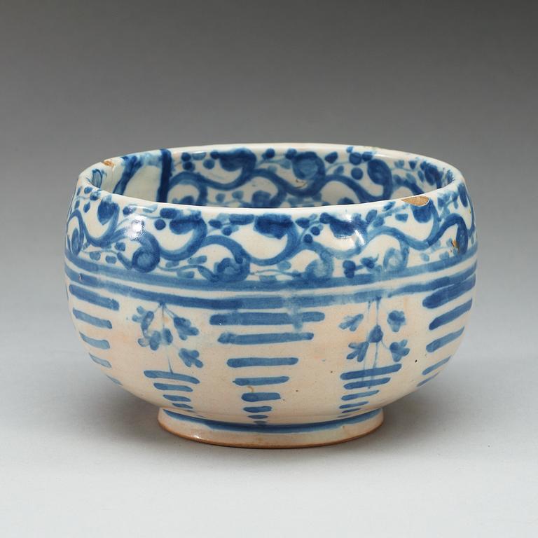 A Spanish faience blue and white bowl. Marked Talavera, presumably 18th Century.
