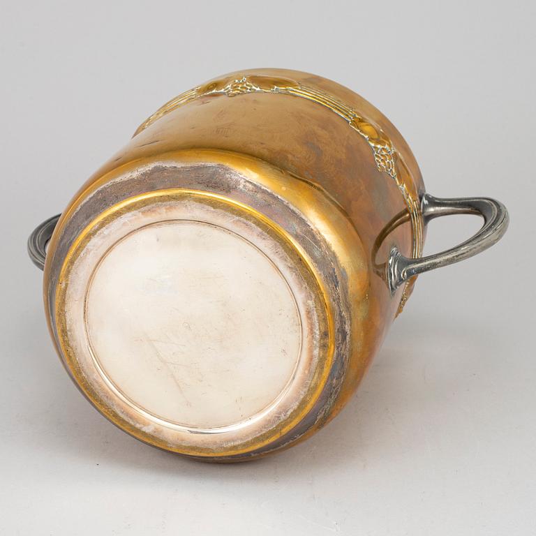 An art nouveau brass champagne cooler, early 20th century.