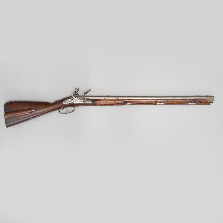 A 18th century flintlock rifle.