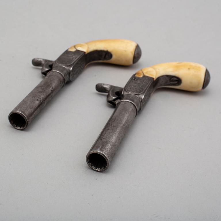 A mid 19th century Belgian rifled percussion pistols with ivory butts in a case.