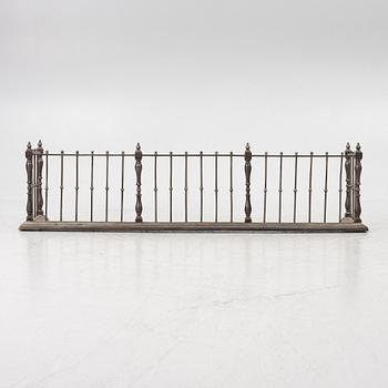An English brass fire gate, circa 1800.