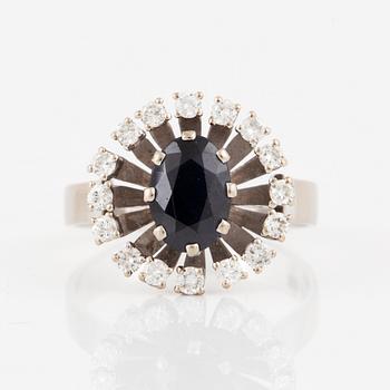 Blue oval sapphire and brilliant-cut diamond ring.