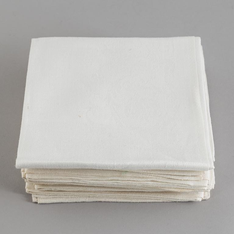 Seven table cloths and 26 napkins, mostly linen, first half of the 20th Century.