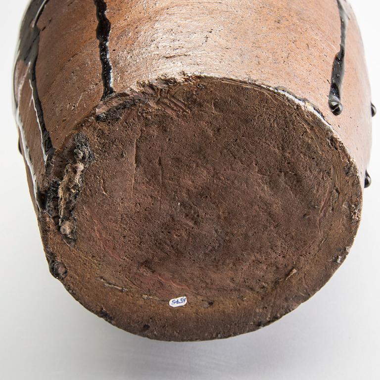 A South East Asian brown and black glazed jar, 14th/17th Century.