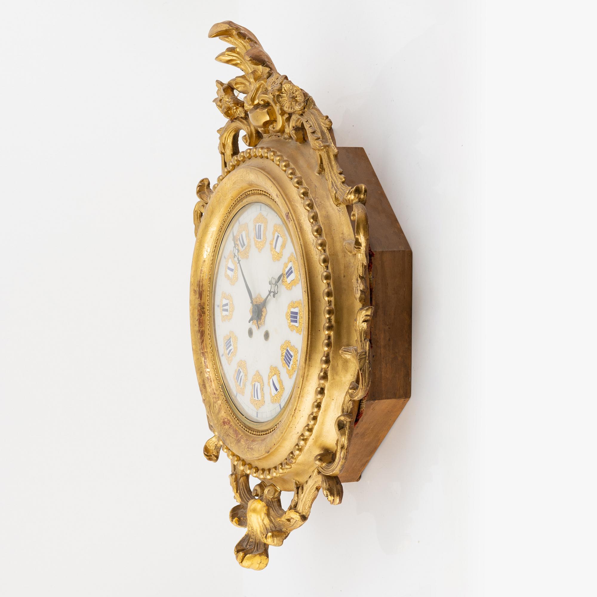 A wall clock, late 19th Century.