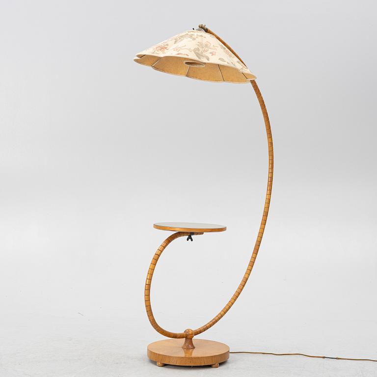 A 1930's/40's floor lamp with table.