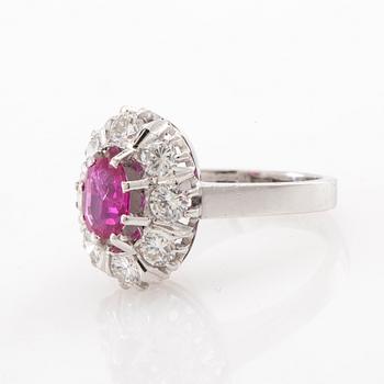 Ring Carmosé 18K white gold with an oval faceted ruby and round brilliant-cut diamonds, Reutners Ystad 1974.