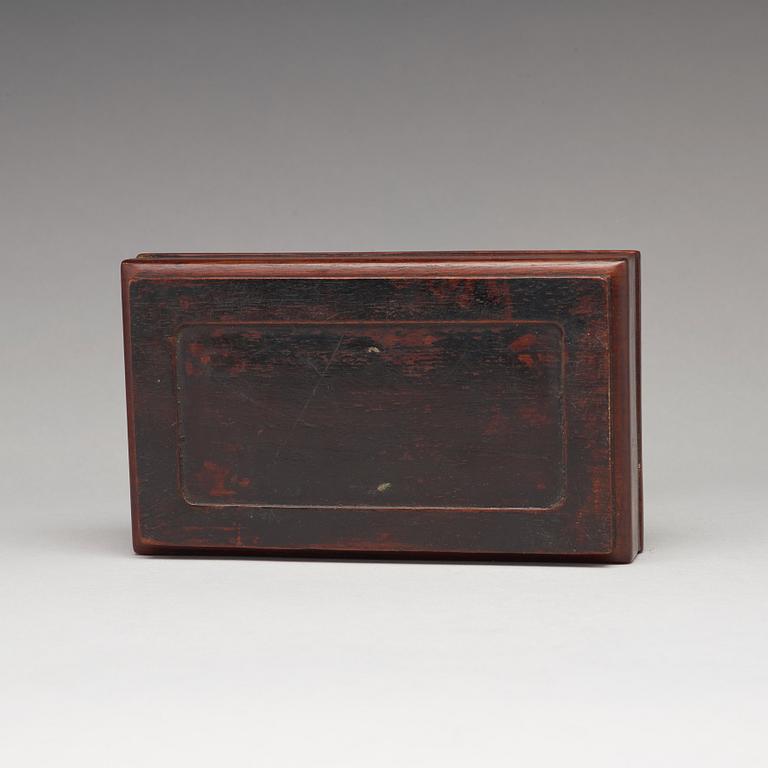 A Chinese wooden box, circa 1900.