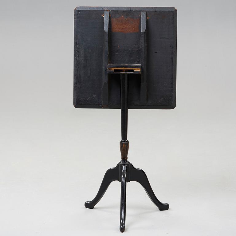 A Swedish tilt top table, from Nils Asplind's workshop signed and dated 1814.