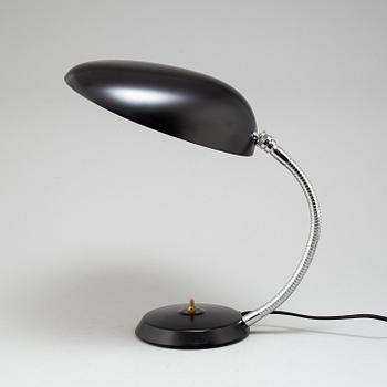 A 'Cobra' table lamp by Greta Magnusson Grossman, Gubi.