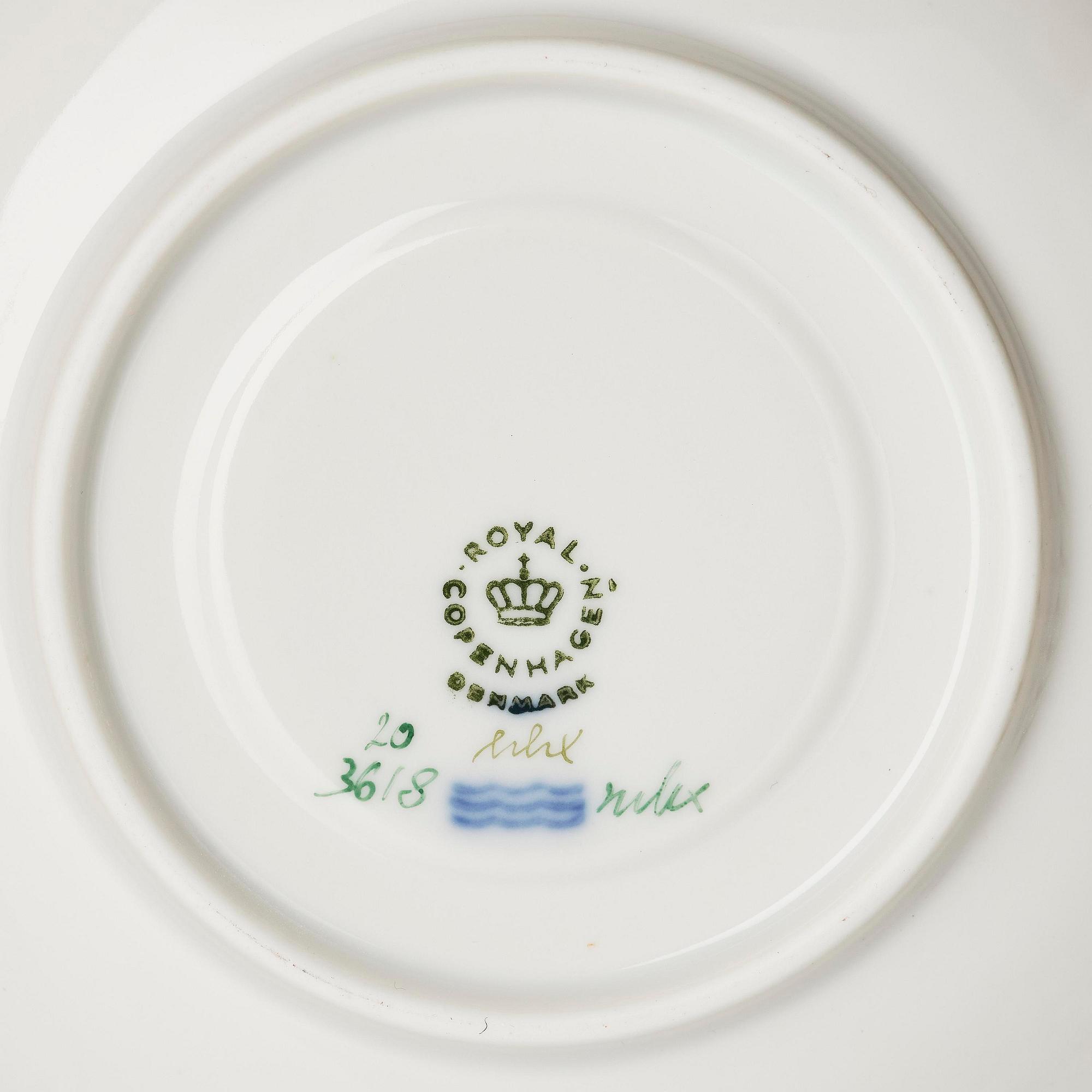 A set of nine Royal Copenhagen 'Flora Danica' cups with saucers, Denmark, 20th century.