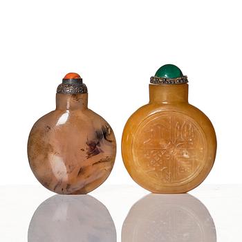 A set of four Chinese snuff bottles and a sculpture, 20th Century.