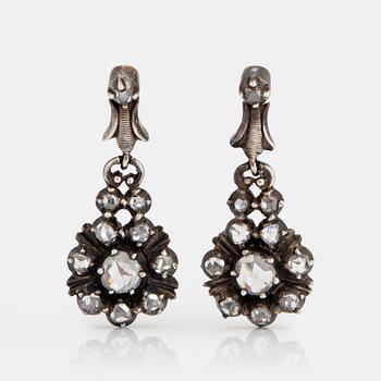 1150. A pair of silver and 18K gold earrings set with rose-cut diamonds.